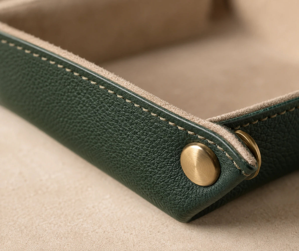 Close detail of Velnoriva NestFold stitching vegan leather and brass snap